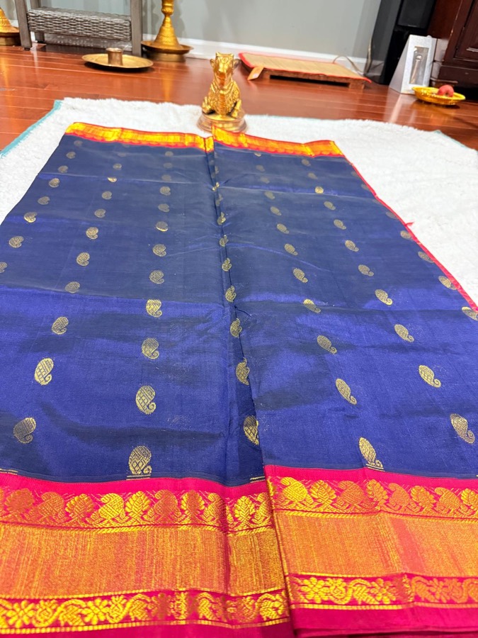Navy handloom saree with gold mango butta and a rani-pink zari border